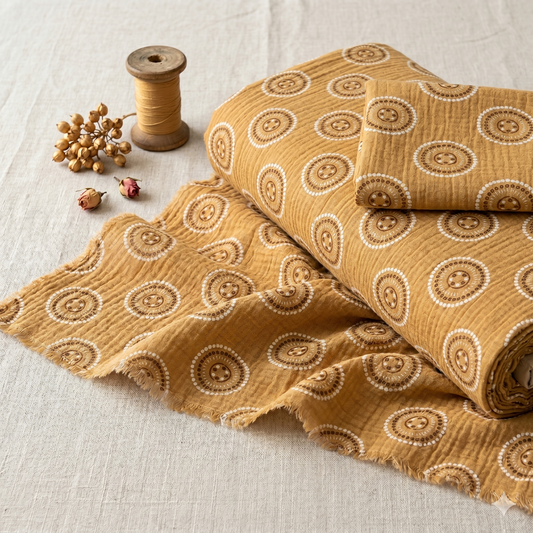 Bekleidungsstoff Button Gold